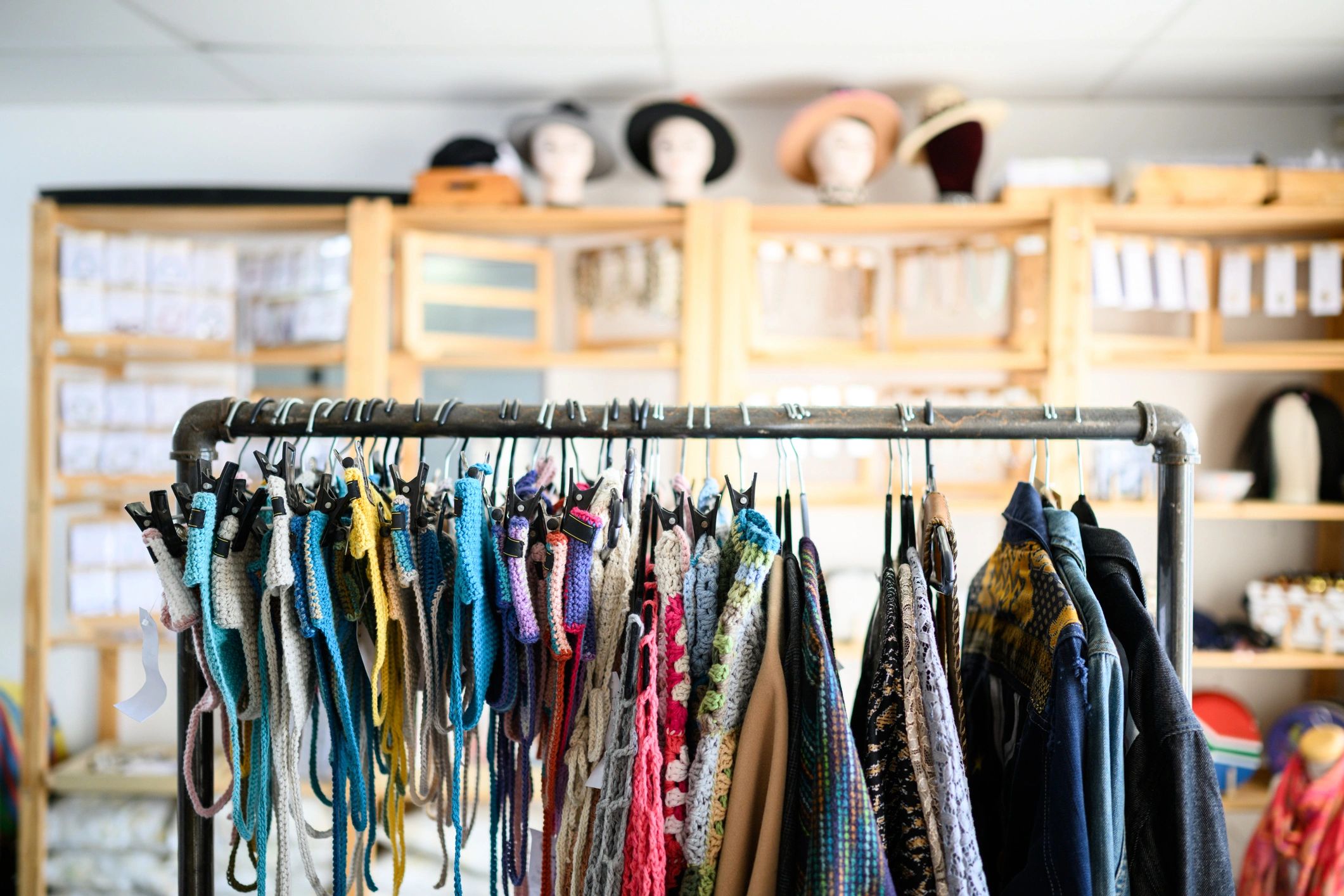 Boutique clothing rack with colorful vintage pieces